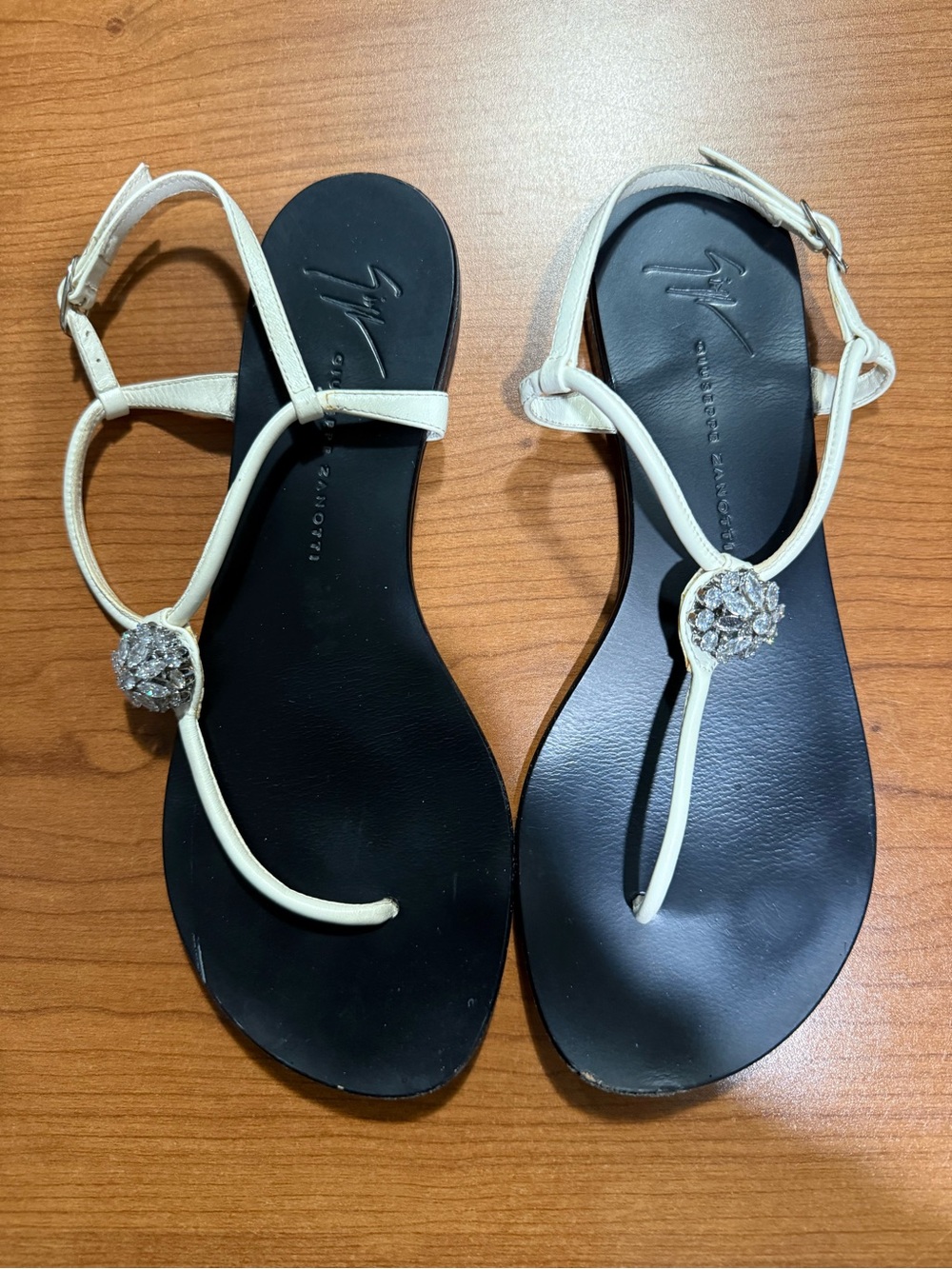 Giuseppe Zanotti Black Footbed White T-Strap Sandals with Rhinestone Detail